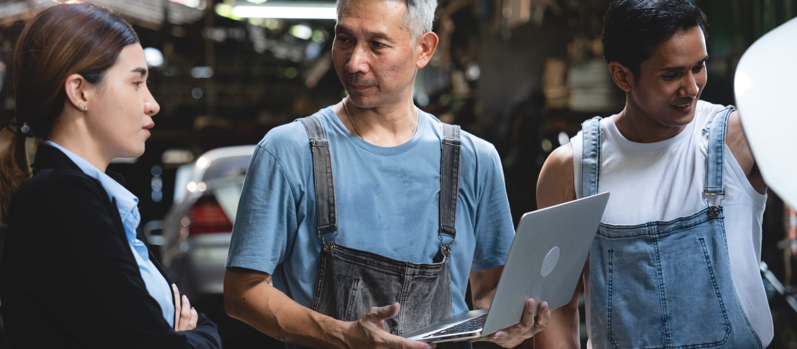 customer talking with professional mechanic worker or workshop owner, client checking a maintenance