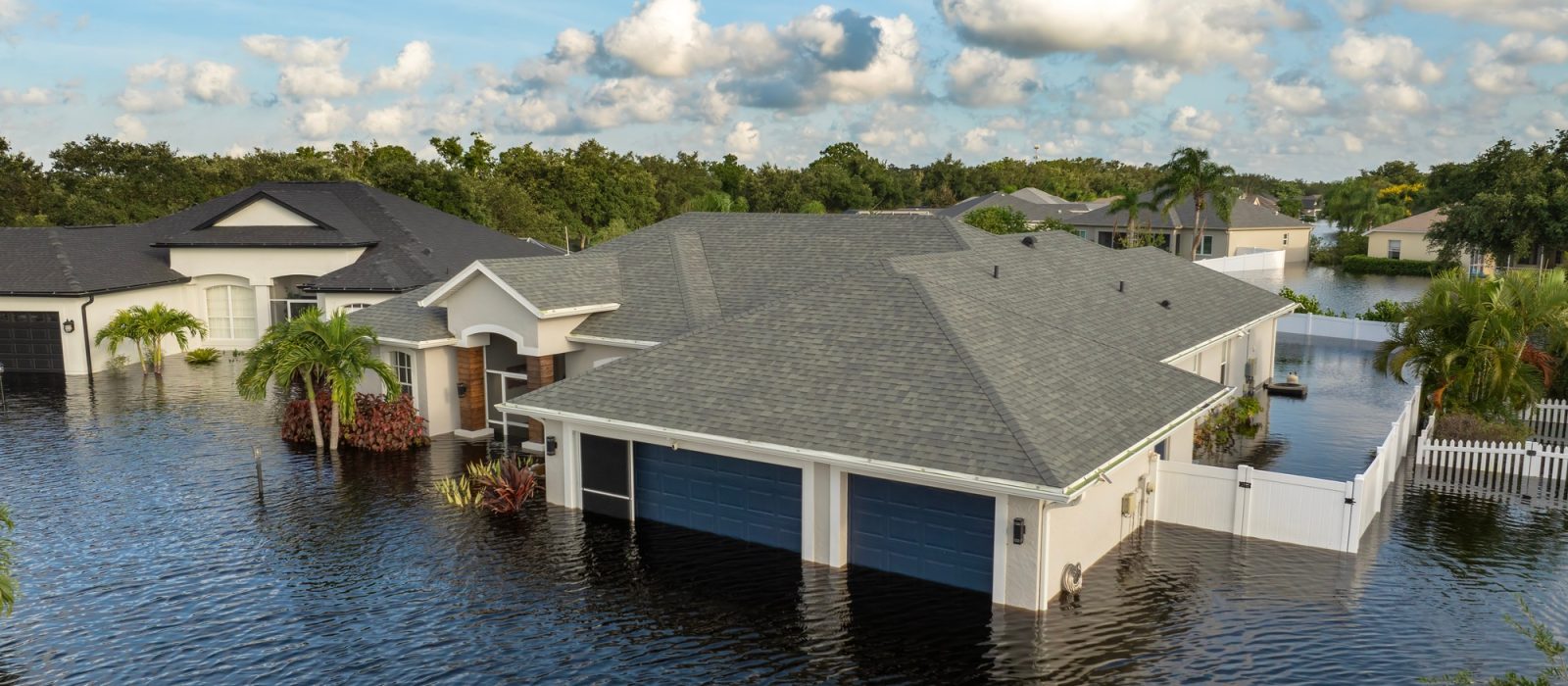Flooded houses from hurricane rainfall water in Florida residential community