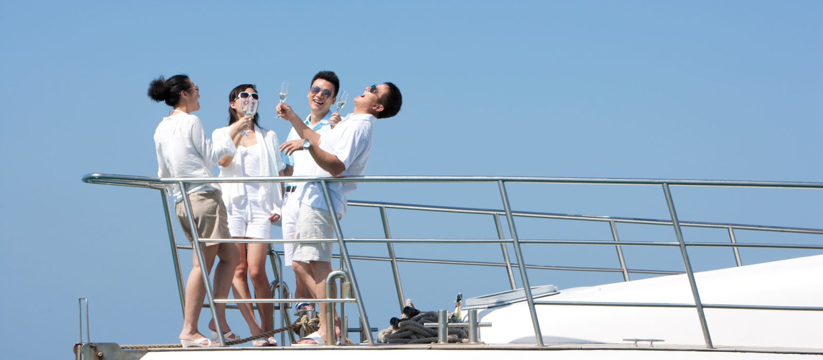 Friends Drinking Champagne on a Yacht