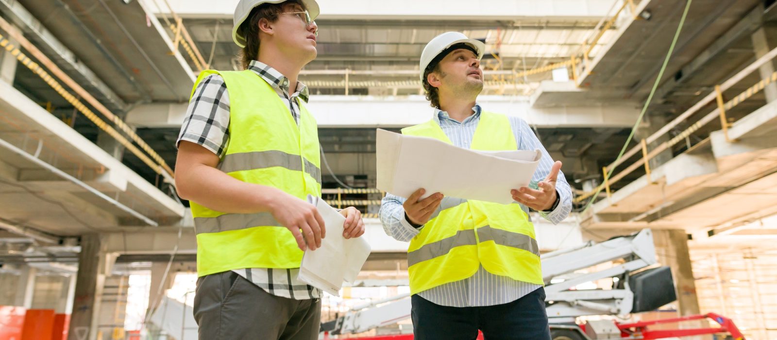 Two business builder people at construction site
